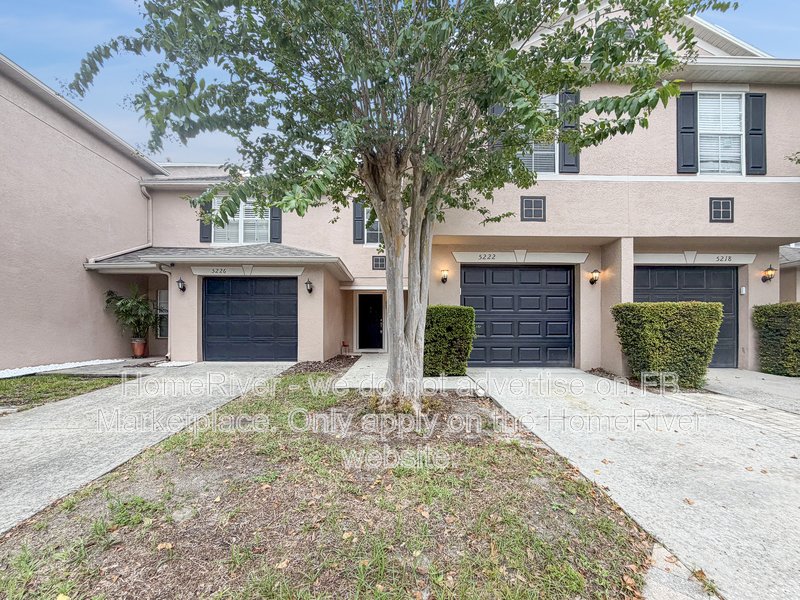 Townhome with a garage property image