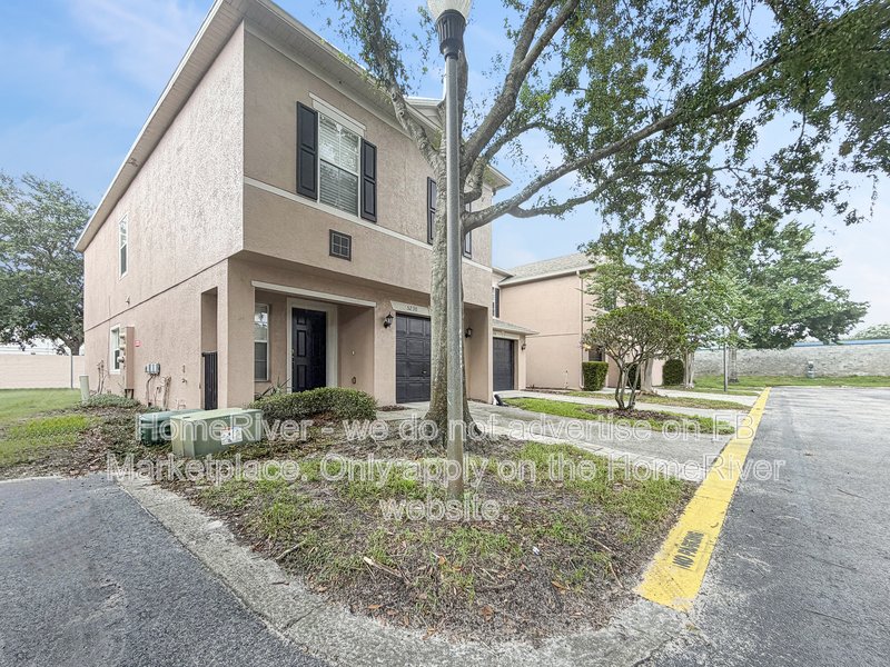 Townhome with a garage property image